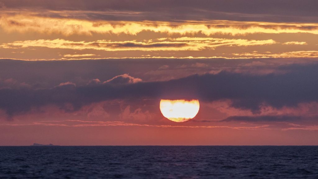 A spectacular red and gold North Sea dawn over the ocean